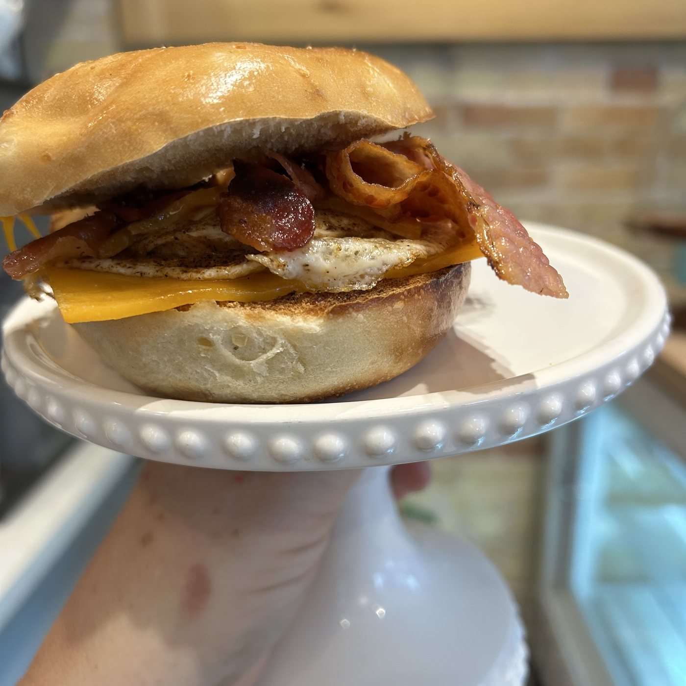 AspenOak Plain Jane bagel sandwich — bacon, egg, and cheese