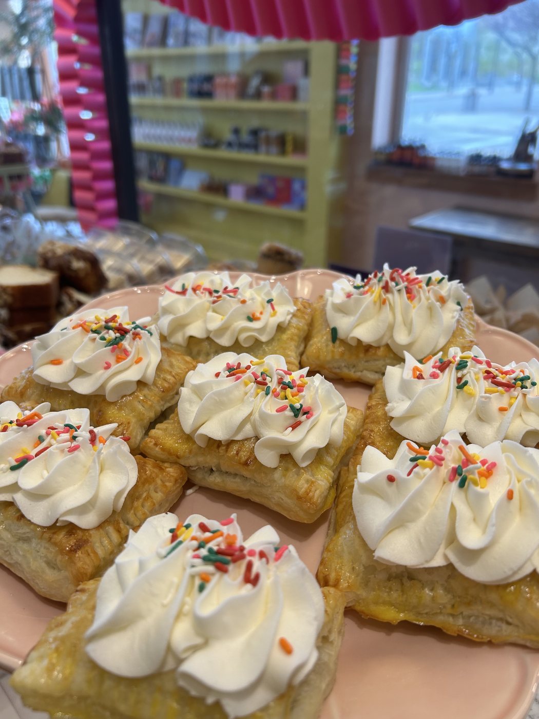 House-made pop-tarts topped with whipped cream and sprinkles