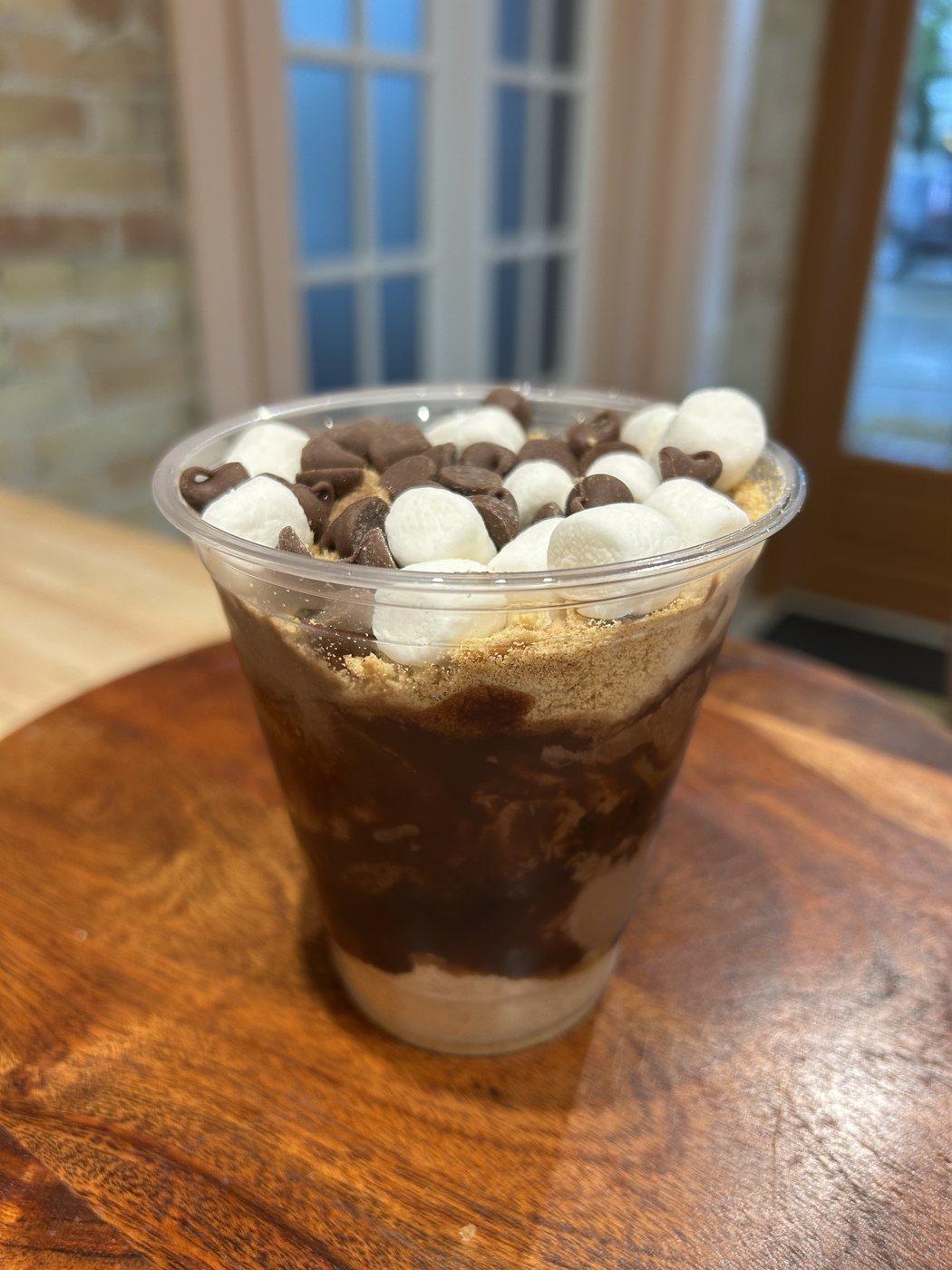 S'mores pudding cup with marshmallows, chocolate chips and graham